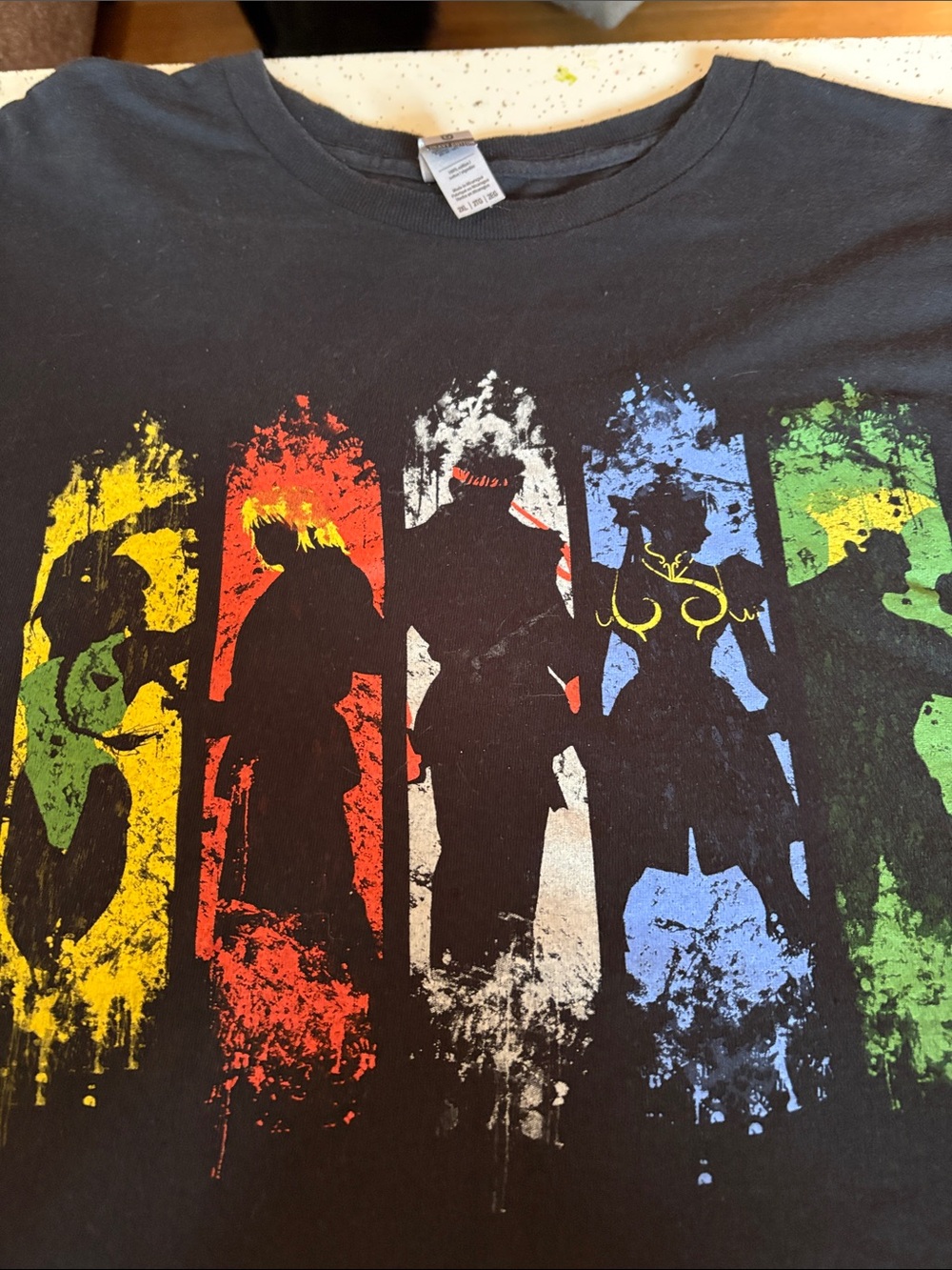 Black Graphic Men’s T-Shirt with Multicolor Character Silhouettes- Shadowfighter